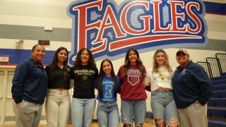 Five Veterans Memorial softball players sign college contracts